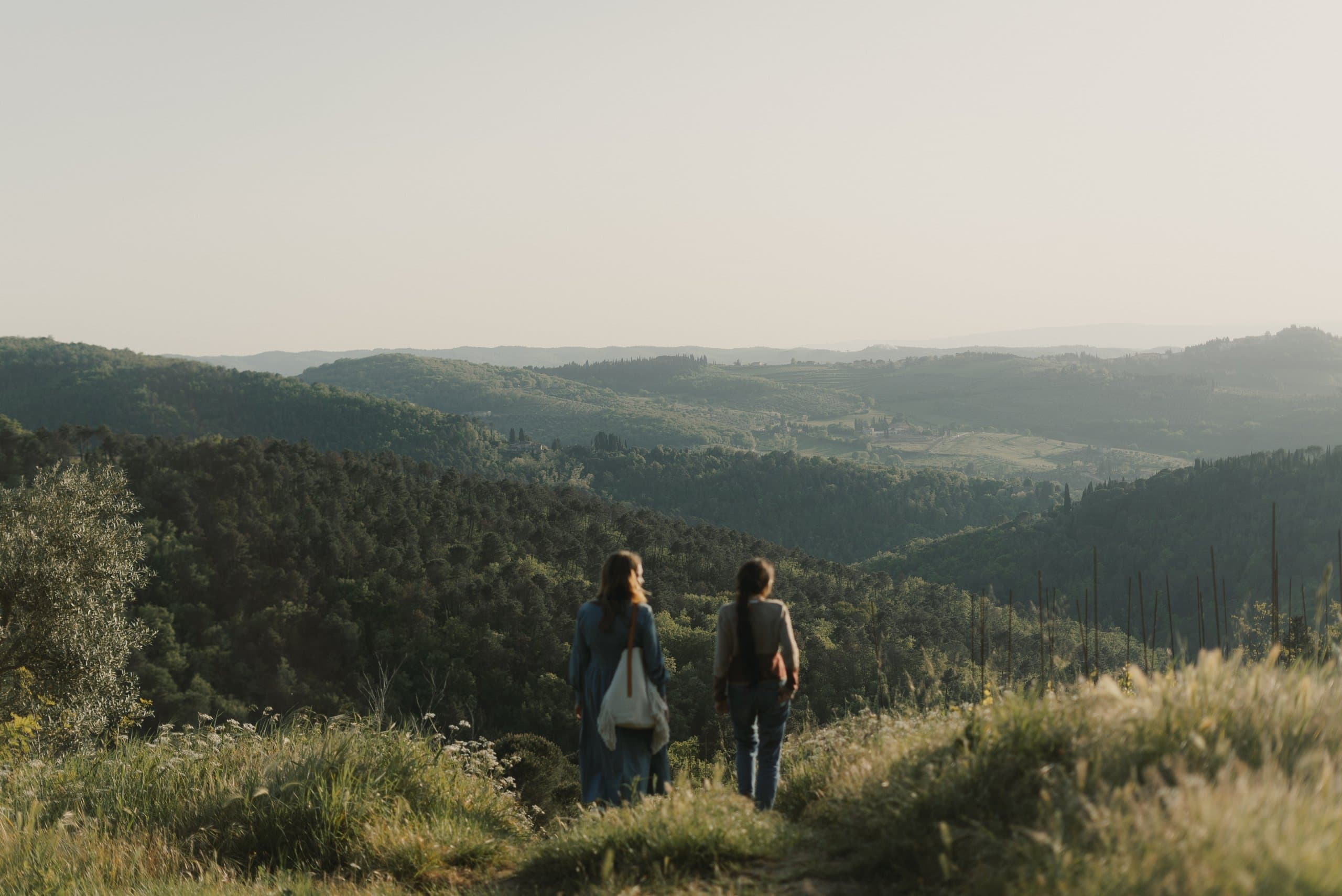 Two people looking out over the Chianti hills from Lamole